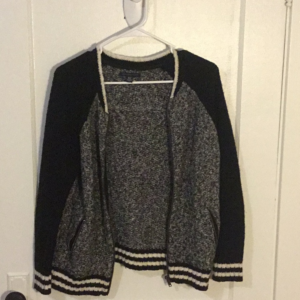 Black,white,and grey sweater.